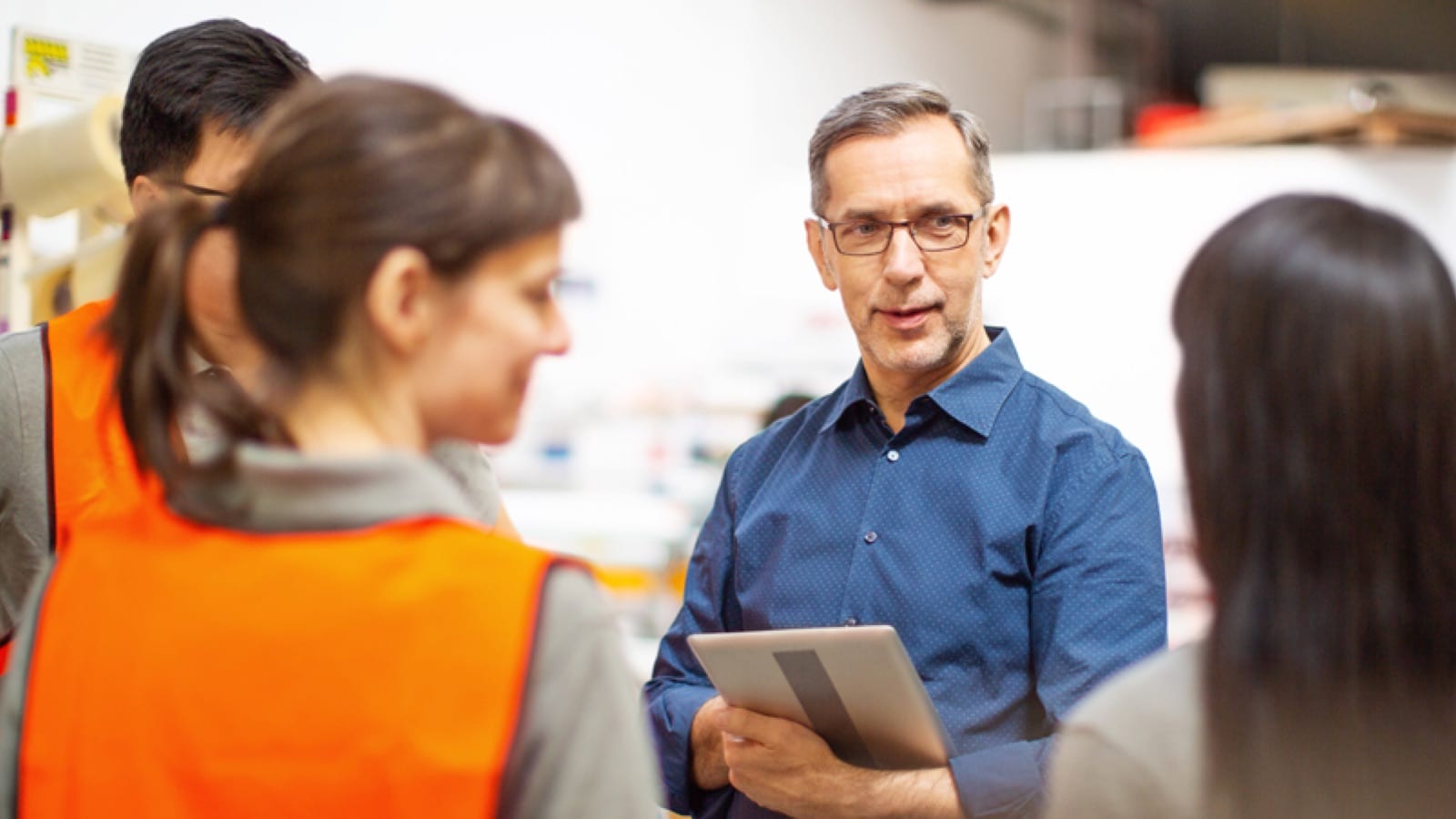 Manager addressing employees